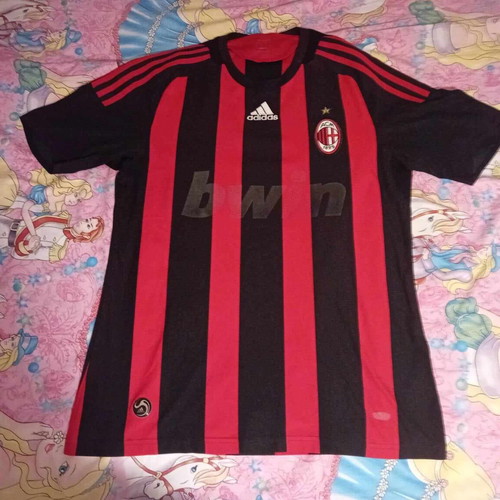 Milan football jersey used, medium size, with faded sponsor