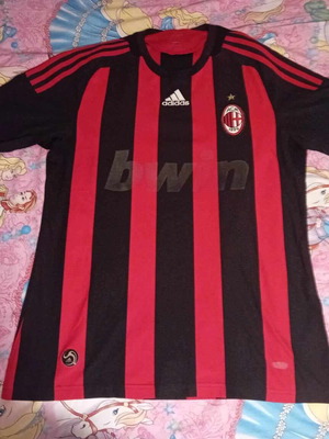 Milan football jersey used, medium size, with faded sponsor
