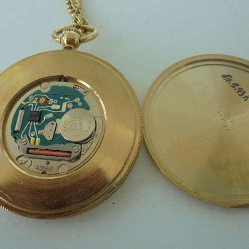 Dugena pocket watch quartz like new, gold color with chain