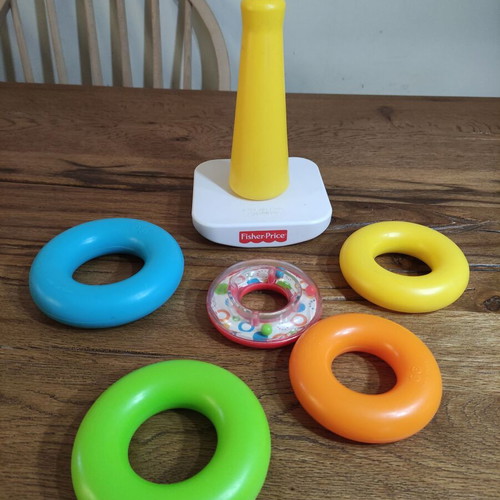 Fisher-Price stacking pyramid like new, 5 colorful rings with rattle base