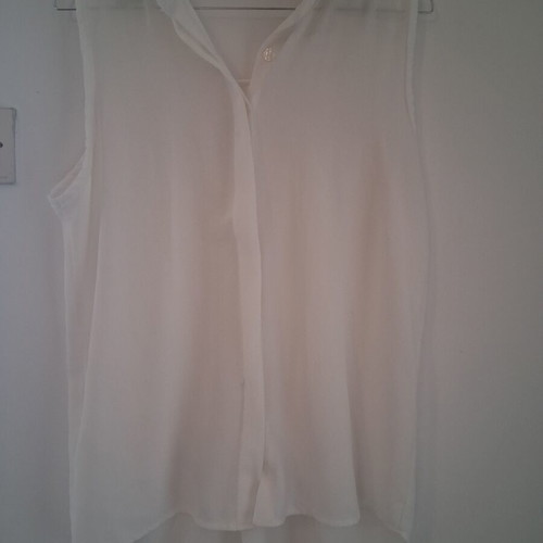 Sleeveless white shirt top