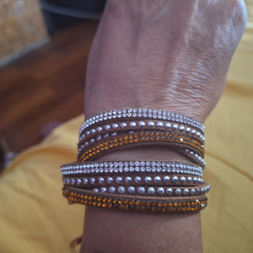 Bracelet with brown, orange, and silver clasp, like new