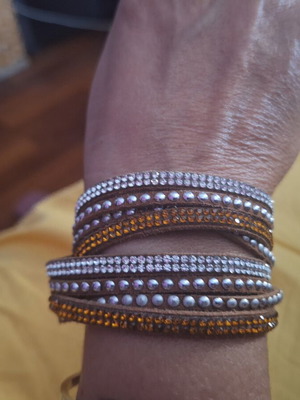 Bracelet with brown, orange, and silver clasp, like new