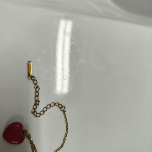 Two stainless steel necklaces like new, red and gold