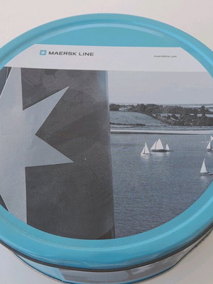 Maersk metal biscuit tin used with some dents