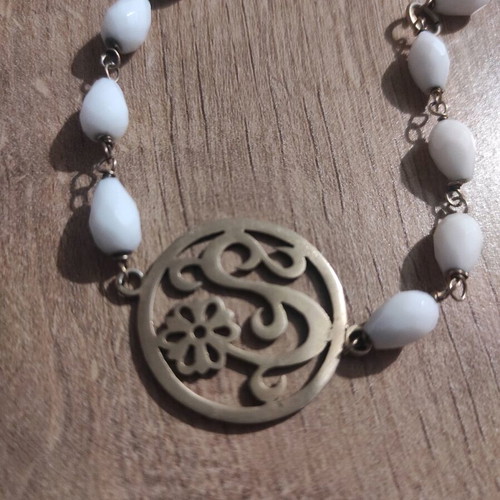 Silver bracelet new with white beads and metal detail