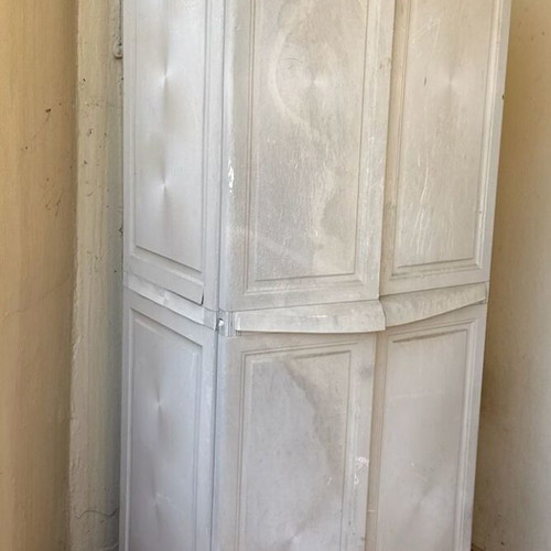 Keter plastic outdoor storage cabinet used, tall and functional