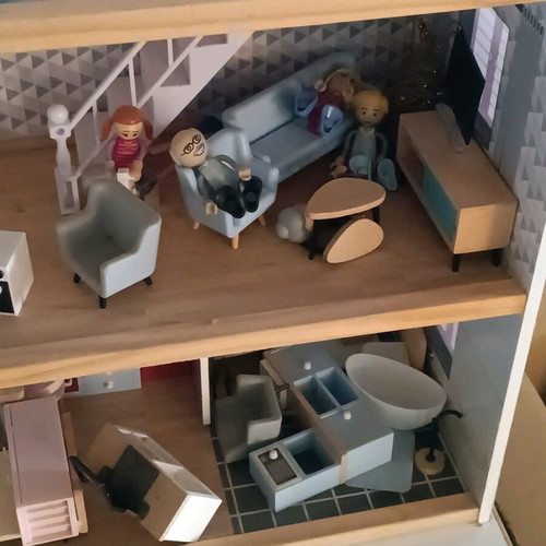 Wooden dollhouse used with extra accessories pack