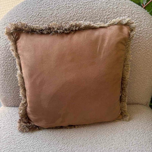 Pillow used in camel color with fringes