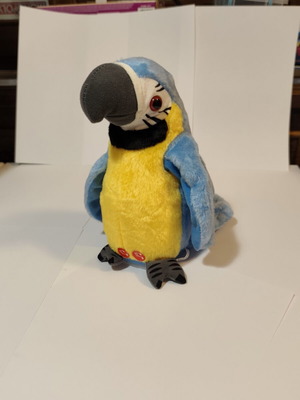 Interactive plush parrot toy with voice repeat and music