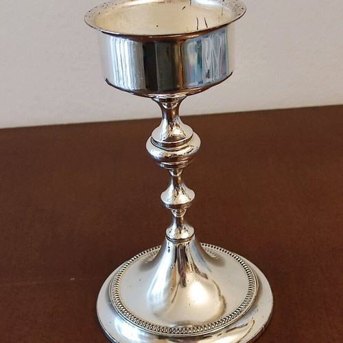Small candlestick like new with glossy metal finish 14cm height