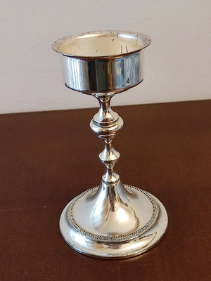 Small candlestick like new with glossy metal finish 14cm height