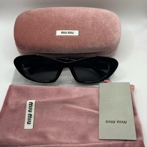 Miu Miu sunglasses new, black and gold for women