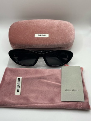 Miu Miu sunglasses new, black and gold for women