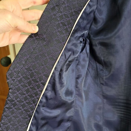 Black H&M jacket with three-quarter sleeve and purple embroidery size medium like new