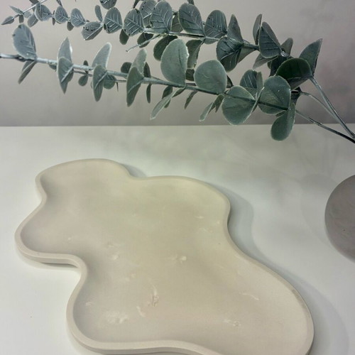 Handmade ceramic tray with organic shape and minimal design