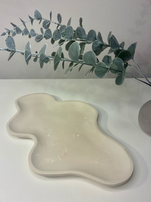 Handmade ceramic tray with organic shape and minimal design