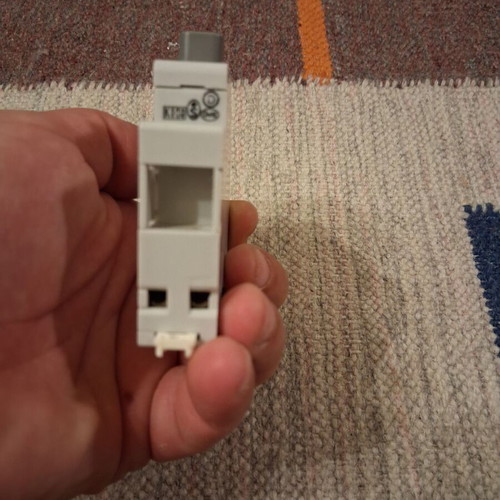 Legrand rail-mounted button switch with indicator light