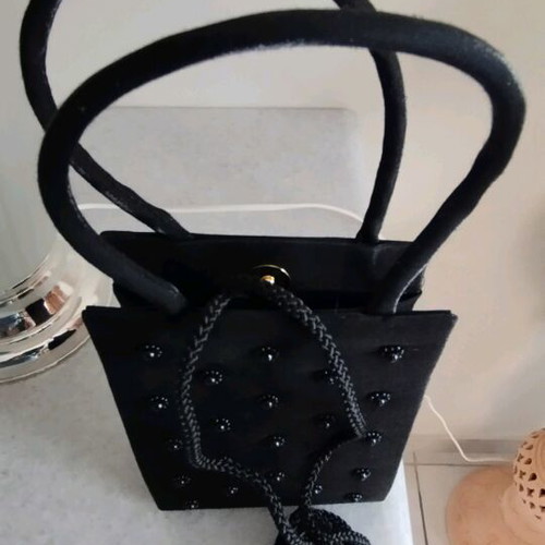 Pocket bag embroidered with black beads like new