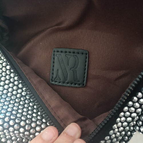 Black crossbody bag with embossed silver rhinestones