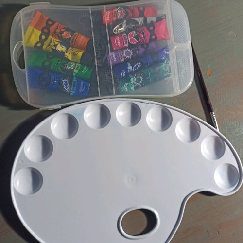 Palette with tempera paints and brush like new, half used colors
