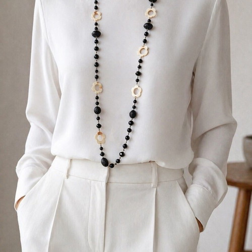 Long necklace like new with black beads and mother of pearl flower decorations