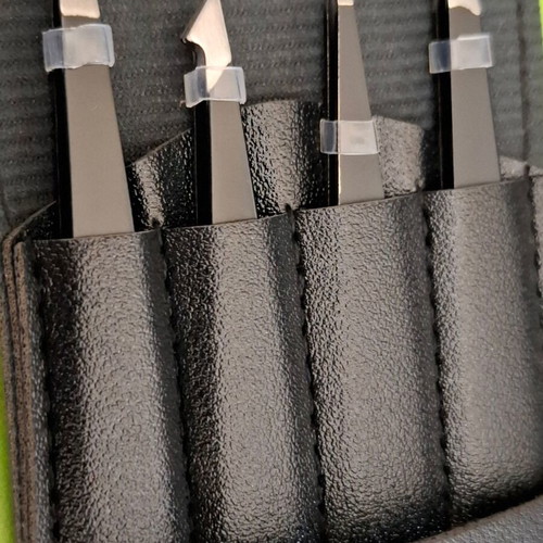 Set of 4 metal tweezers in case new