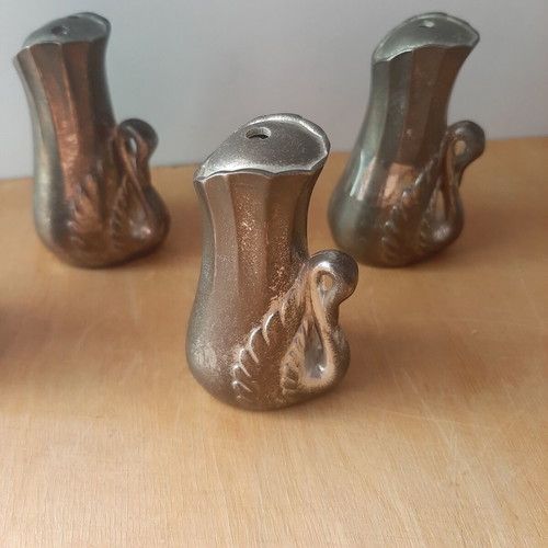 Vintage salt and pepper set with swan designs, used, 4 pieces