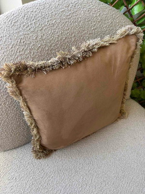 Pillow used in camel color with fringes