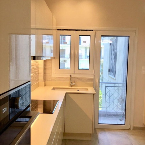 Modern kitchen with quartz countertop and granite undermount sink like new, beige lacquer