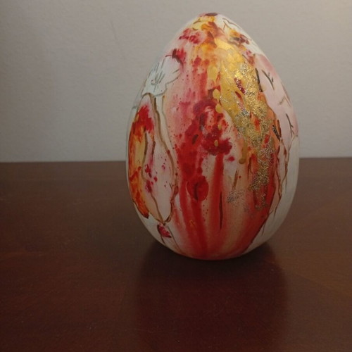 Hand-painted ceramic egg with floral and female figure design