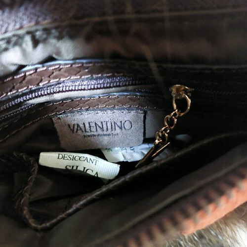 Handbag new with synthetic brown fur and croco print