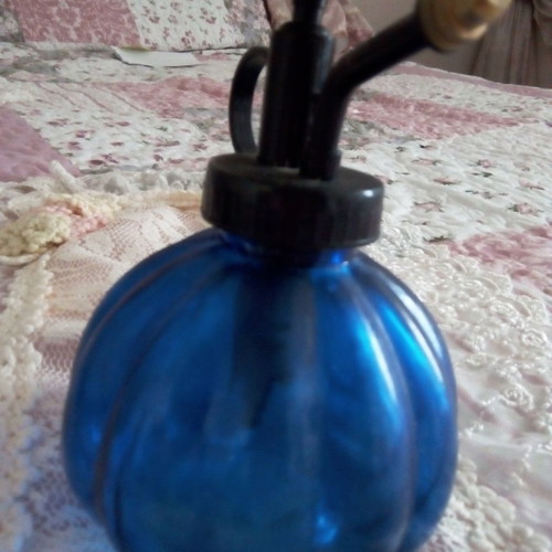 Antique cologne atomizers used, blue and purple