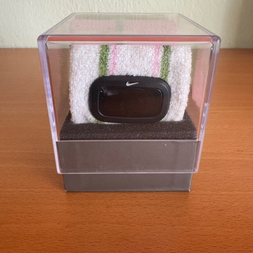 Nike sports watch used with white, green and pink wristband