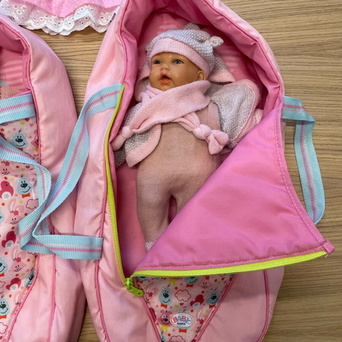 Baby doll like new vinyl with sleeping bag and knitted clothes
