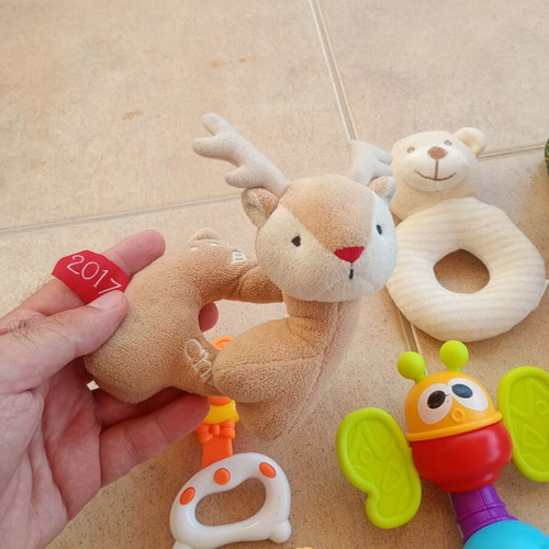 Set of 32 baby rattles including plush toys and large dice