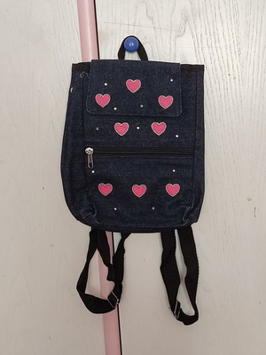 Small denim backpack with heart designs like new