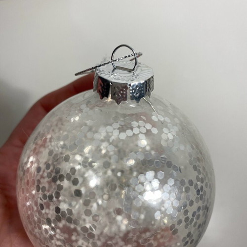 Christmas ball with silver glitter like new, transparent
