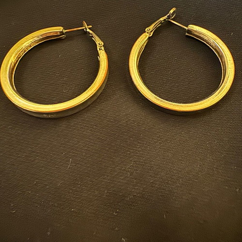 Thick silver hoop earrings used with some imperfections