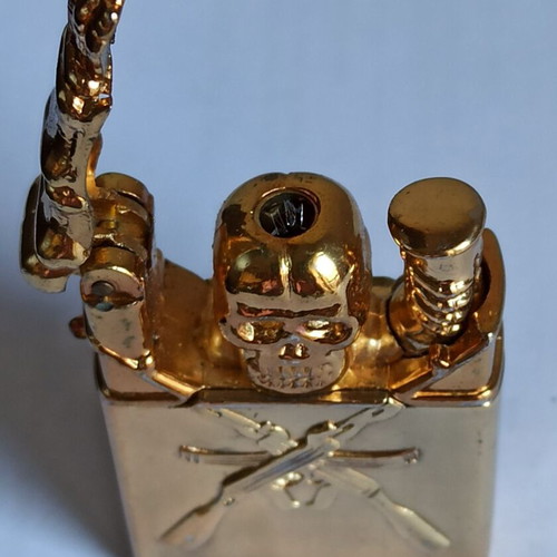 Vintage metal windproof lighter with skull and crossed rifles