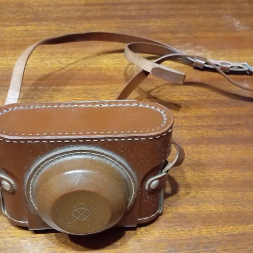 Retro Smena-4 camera used with leather case and tripod mount