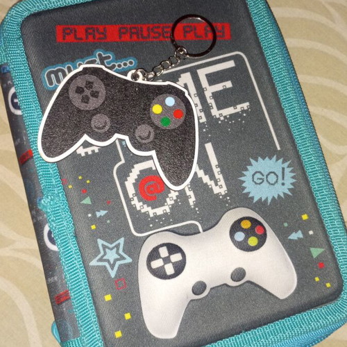 Must pencil case like new with Play Station controller theme and keychain