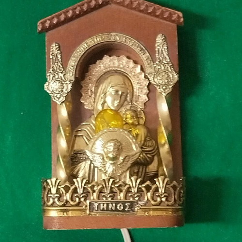 Vintage illuminated icon of Virgin Mary and Christ Child with lamp