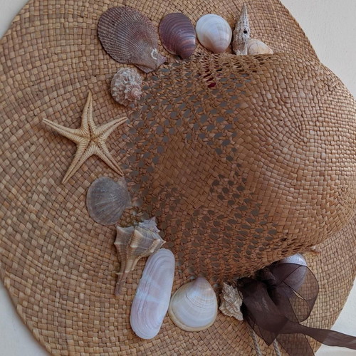 Handmade straw hat with seashells