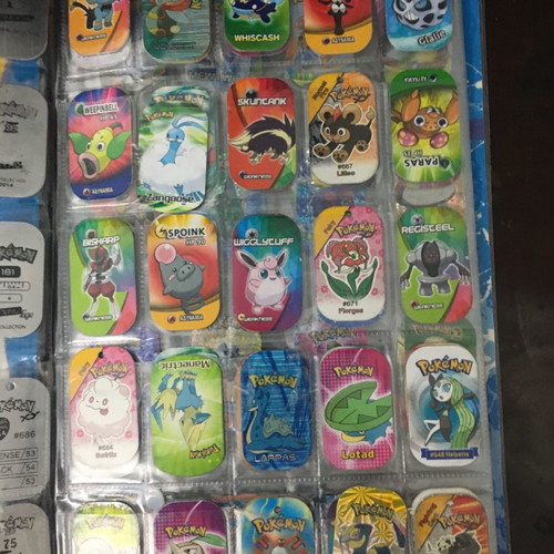 Pokémon album with metal tags used