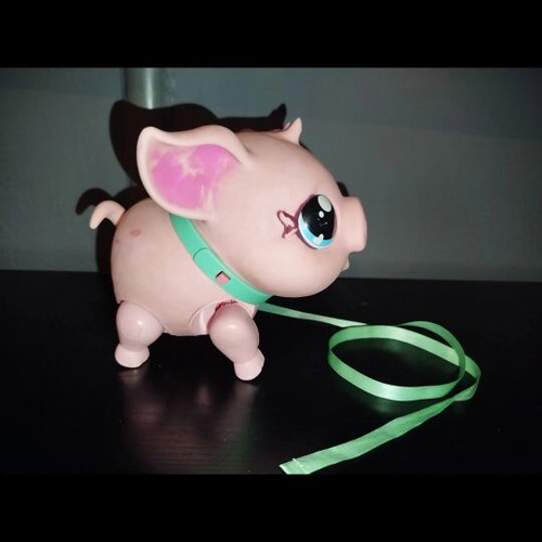 Electronic robotic pig used with sound and movement