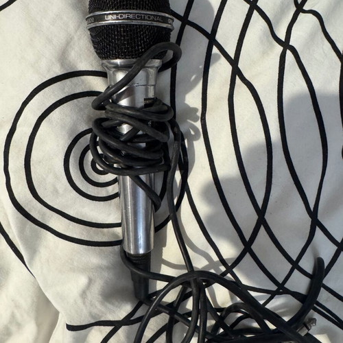 Dynamic microphone used with cable and on/off switch