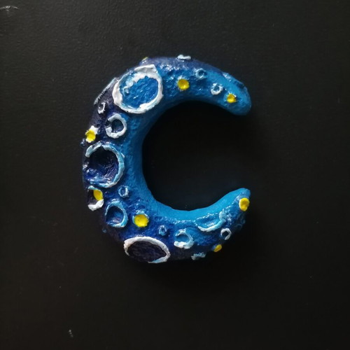 Handmade magnet from white cement with acrylics and varnish