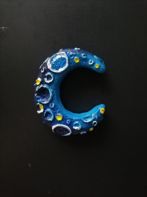 Handmade magnet from white cement with acrylics and varnish