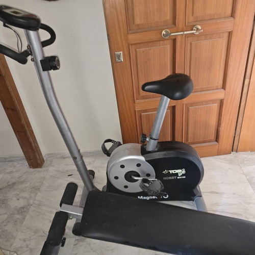 Stationary bike and incline abdominal bench used, good condition
